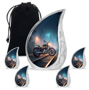 Cornflower Blue Bike Cremation Urn side profile showing urn shape - graceful tear-shaped urn with bike motif - memorial set with one large and four small urns