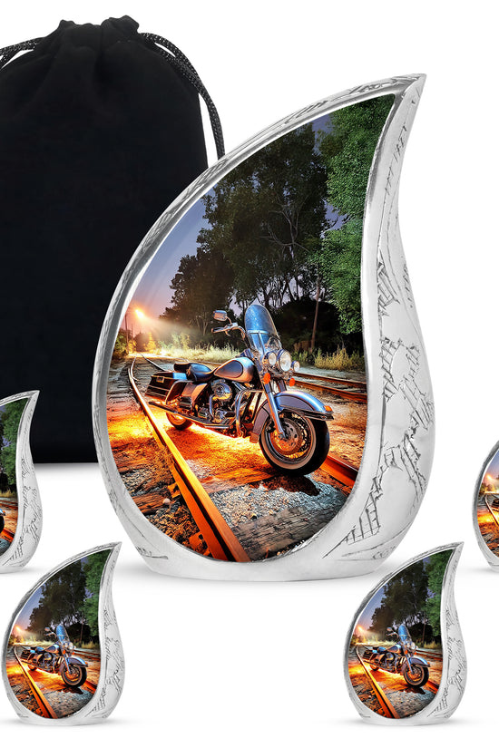 Sky Blue Bike Cremation Urn side profile showing urn shape - rounded teardrop bike design with delicate detail - memorial set with one large and four small urns