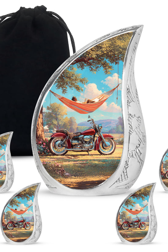 Sea Green Teal Bike Cremation Urn side profile showing urn shape - flowing teardrop bike silhouette on curved aluminum - memorial set with one large and four small urns