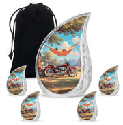 Sea Green Teal Bike Cremation Urn side profile showing urn shape - flowing teardrop bike silhouette on curved aluminum - memorial set with one large and four small urns