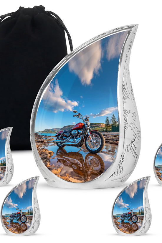 Steel Blue Bike Cremation Urn side profile showing urn shape - smooth teardrop contour featuring bike art - memorial set with one large and four small urns