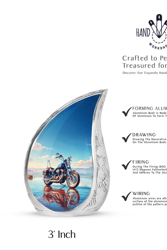 Calming Blue Bike Cremation Urn angled view of lid and engraved motif - smooth teardrop contour featuring bike art - mini keepsake memorial for portion of cremation ashes