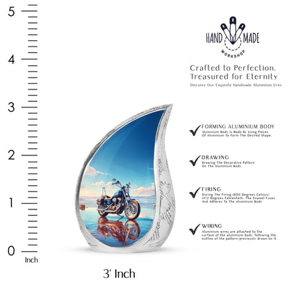 Calming Blue Bike Cremation Urn angled view of lid and engraved motif - smooth teardrop contour featuring bike art - mini keepsake memorial for portion of cremation ashes