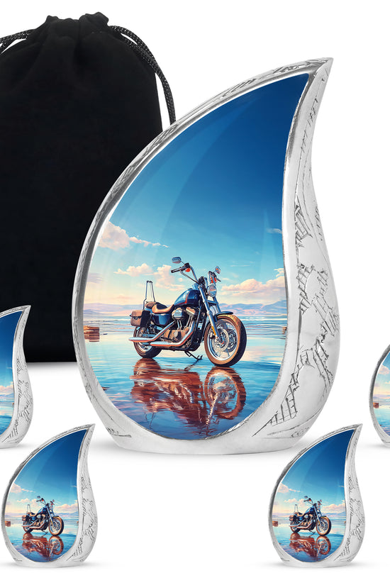 Icy Blue Bike Cremation Urn side profile showing urn shape - rounded teardrop bike design with delicate detail - memorial set with one large and four small urns