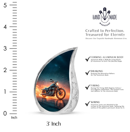 Indigo Bike Cremation Urn angled view of lid and engraved motif - rounded teardrop bike design with delicate detail - mini keepsake memorial for portion of cremation ashes