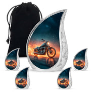 Azure Bike Cremation Urn side profile showing urn shape - flowing teardrop bike silhouette on curved aluminum - memorial set with one large and four small urns
