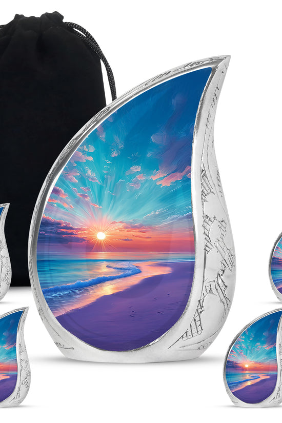 Cool Teal Beach Cremation Urn side profile showing urn shape - flowing teardrop beach silhouette on curved aluminum - memorial set with one large and four small urns