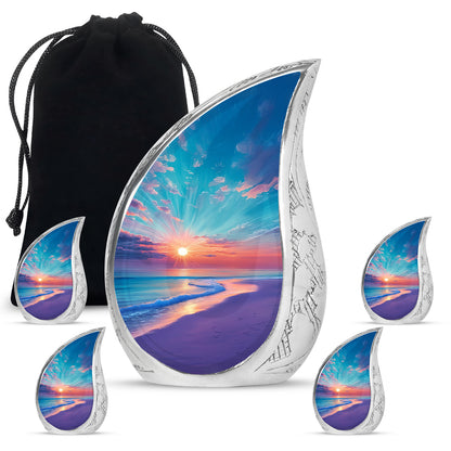 Cool Teal Beach Cremation Urn side profile showing urn shape - flowing teardrop beach silhouette on curved aluminum - memorial set with one large and four small urns