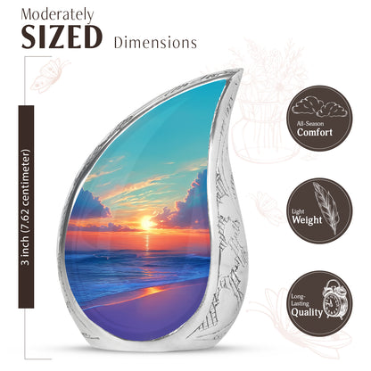 Mystic Teal Beach Cremation Urn angled view of lid and engraved motif - smooth teardrop contour featuring beach art - mini keepsake memorial for portion of cremation ashes