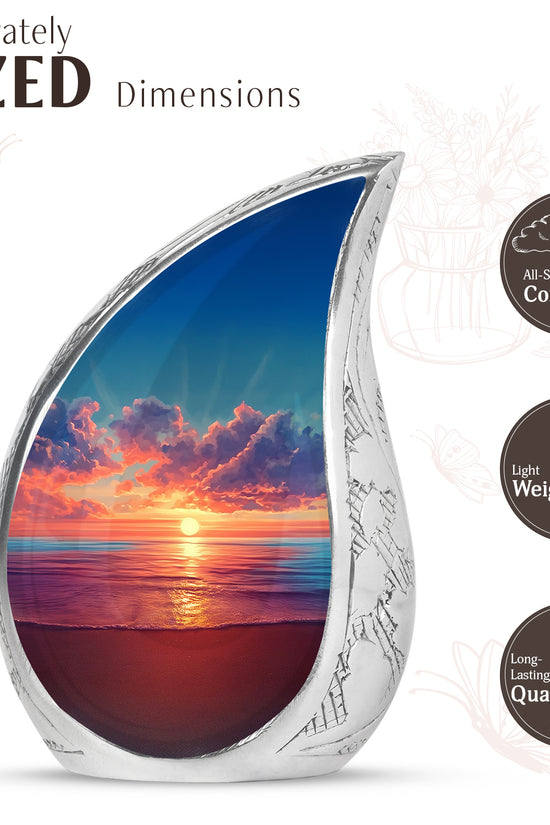 Twilight Blue Beach Cremation Urn angled view of lid and engraved motif - graceful tear-shaped urn with beach motif - mini keepsake memorial for portion of cremation ashes