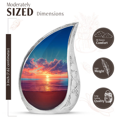 Twilight Blue Beach Cremation Urn angled view of lid and engraved motif - graceful tear-shaped urn with beach motif - mini keepsake memorial for portion of cremation ashes