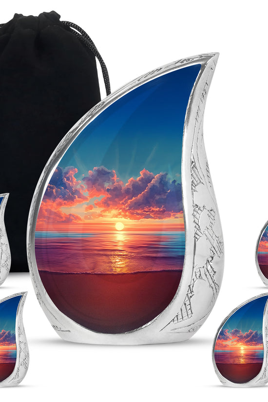 Icy Blue Beach Cremation Urn side profile showing urn shape - flowing teardrop beach silhouette on curved aluminum - memorial set with one large and four small urns