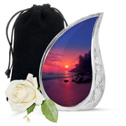Peony Pink Beach Cremation Urn front view showing detailed design - flowing teardrop beach silhouette on curved aluminum - full-size 10 inch 200 cubic inch adult cremation urn