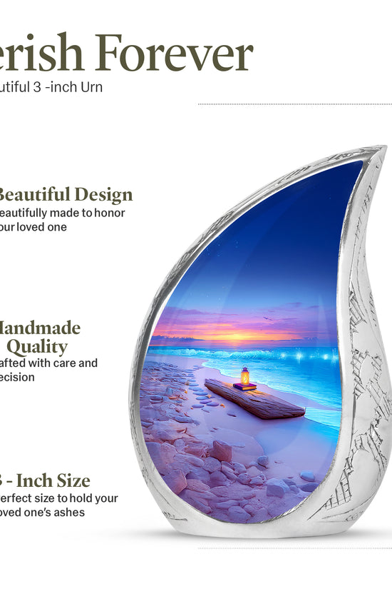 Indigo Beach Cremation Urn angled view of lid and engraved motif - rounded teardrop beach design with delicate detail - mini keepsake memorial for portion of cremation ashes
