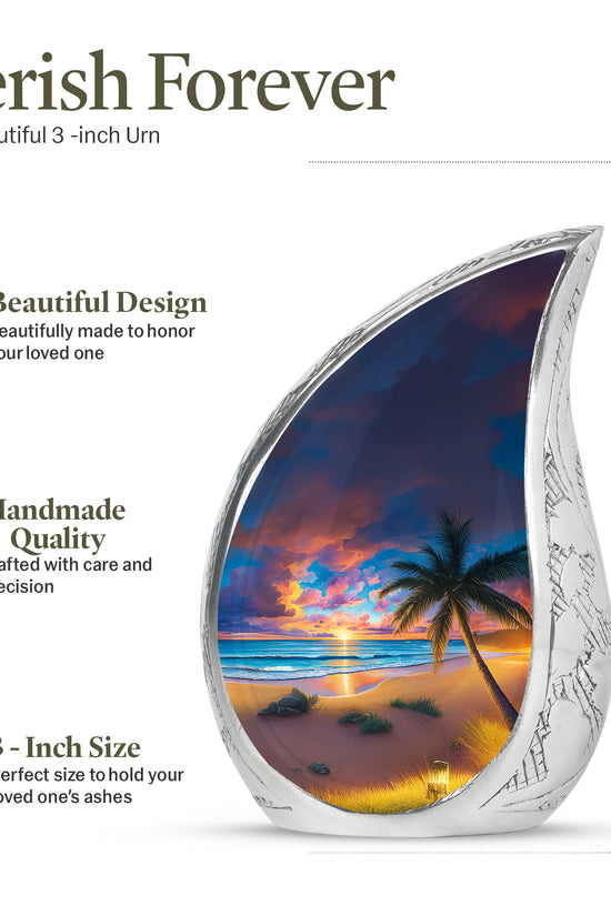 Twilight Blue Beach Cremation Urn angled view of lid and engraved motif - smooth teardrop contour featuring beach art - mini keepsake memorial for portion of cremation ashes