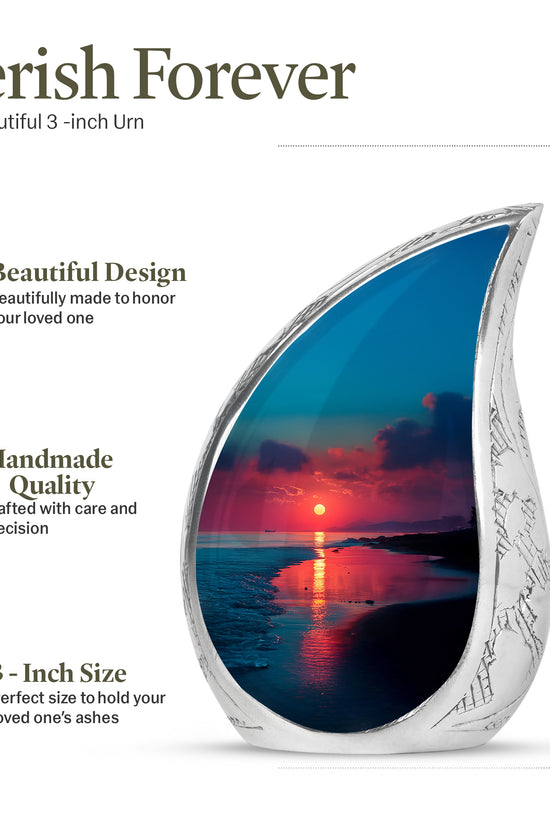 Soft Blue Beach Cremation Urn angled view of lid and engraved motif - graceful tear-shaped urn with beach motif - mini keepsake memorial for portion of cremation ashes