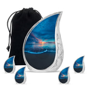Navy Blue Beach Cremation Urn side profile showing urn shape - rounded teardrop beach design with delicate detail - memorial set with one large and four small urns