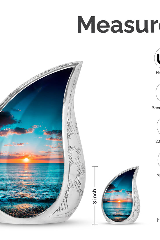 Cool Teal Beach Cremation Urn angled view of lid and engraved motif - flowing teardrop beach silhouette on curved aluminum - mini keepsake memorial for portion of cremation ashes