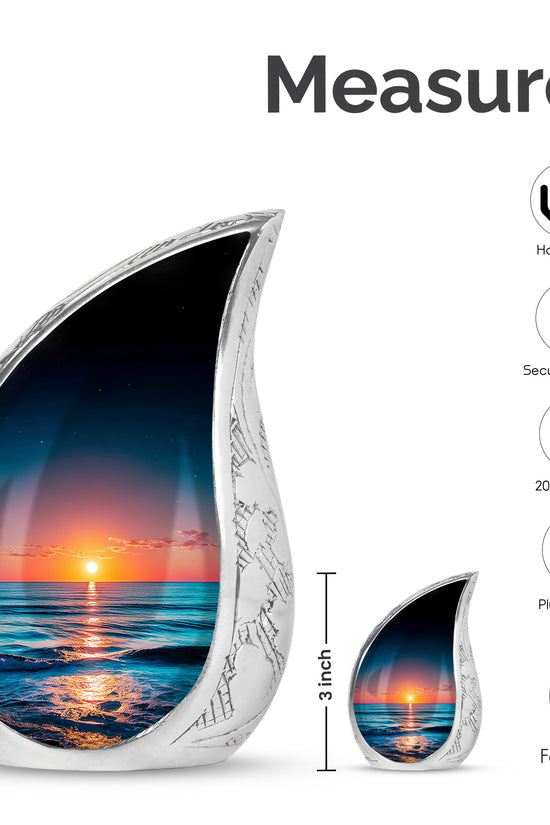 Celestial Blue Beach Cremation Urn angled view of lid and engraved motif - flowing teardrop beach silhouette on curved aluminum - mini keepsake memorial for portion of cremation ashes
