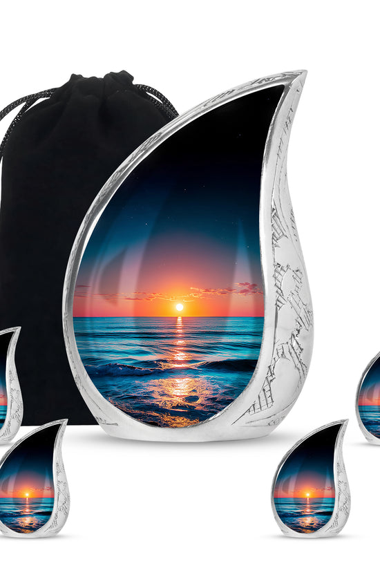 Cobalt Blue Beach Cremation Urn side profile showing urn shape - graceful tear-shaped urn with beach motif - memorial set with one large and four small urns