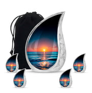 Cobalt Blue Beach Cremation Urn side profile showing urn shape - graceful tear-shaped urn with beach motif - memorial set with one large and four small urns