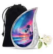 Indigo Beach Cremation Urn front view showing detailed design - flowing teardrop beach silhouette on curved aluminum - full-size 10 inch 200 cubic inch adult cremation urn