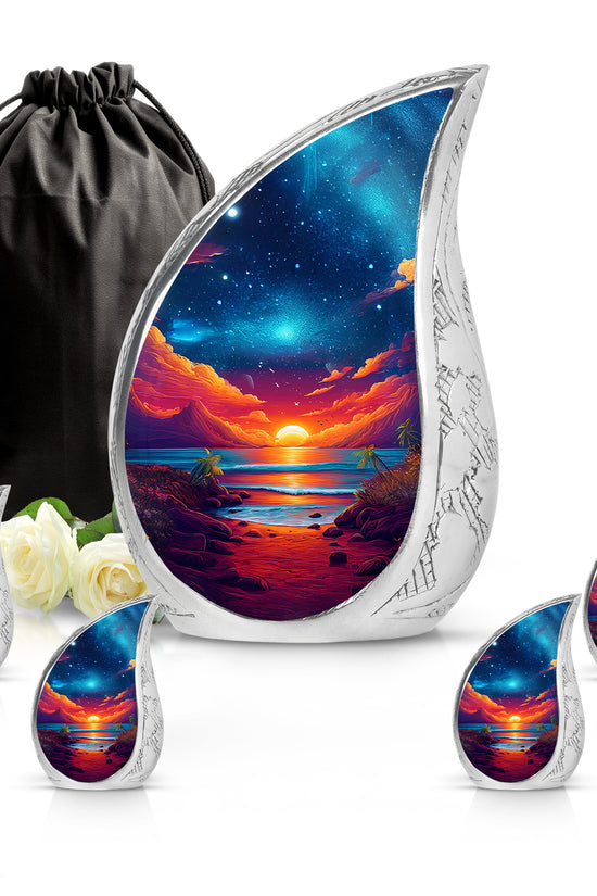 Dusty Blue Beach Cremation Urn side profile showing urn shape - flowing teardrop beach silhouette on curved aluminum - memorial set with one large and four small urns