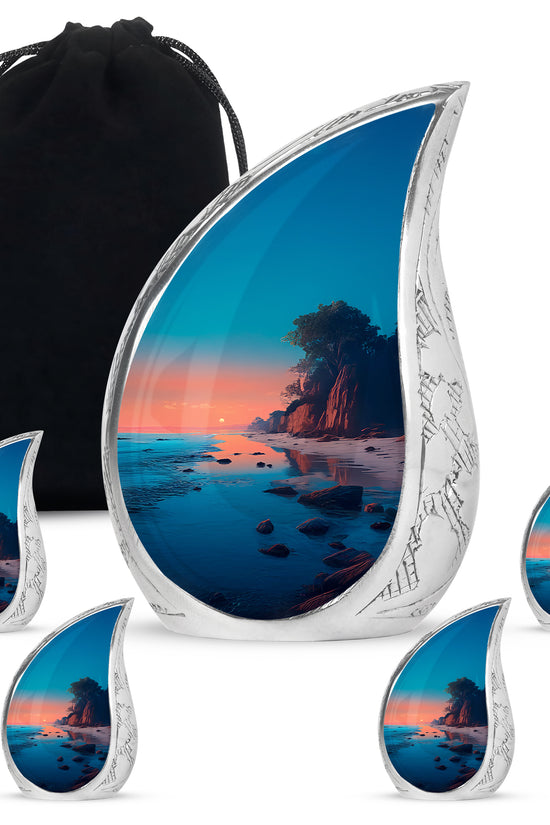 Jewel Teal Beach Cremation Urn side profile showing urn shape - flowing teardrop beach silhouette on curved aluminum - memorial set with one large and four small urns