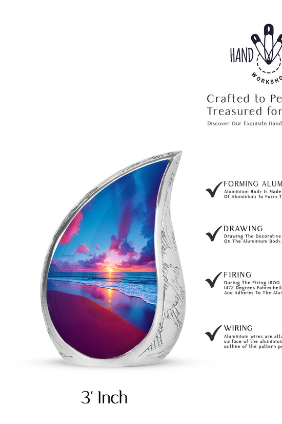 Cornflower Blue Beach Cremation Urn angled view of lid and engraved motif - smooth teardrop contour featuring beach art - mini keepsake memorial for portion of cremation ashes