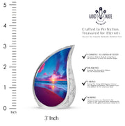 Cornflower Blue Beach Cremation Urn angled view of lid and engraved motif - smooth teardrop contour featuring beach art - mini keepsake memorial for portion of cremation ashes
