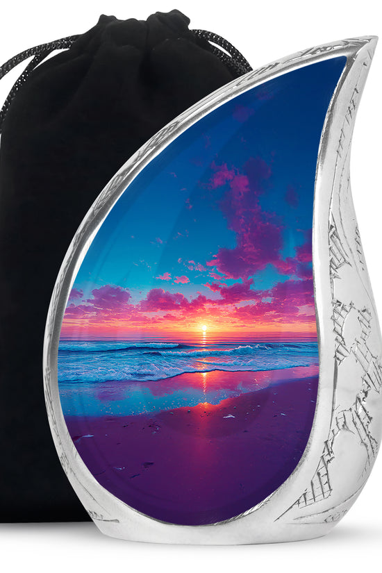Misty Blue Beach Cremation Urn front view showing detailed design - flowing teardrop beach silhouette on curved aluminum - full-size 10 inch 200 cubic inch adult cremation urn