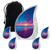 Azure Beach Cremation Urn side profile showing urn shape - flowing teardrop beach silhouette on curved aluminum - memorial set with one large and four small urns