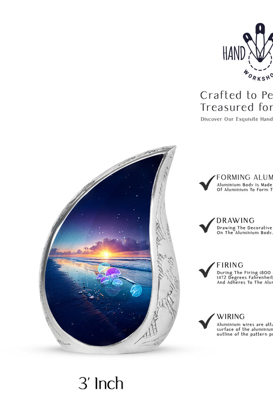 Cobalt Blue Beach Cremation Urn angled view of lid and engraved motif - graceful tear-shaped urn with beach motif - mini keepsake memorial for portion of cremation ashes