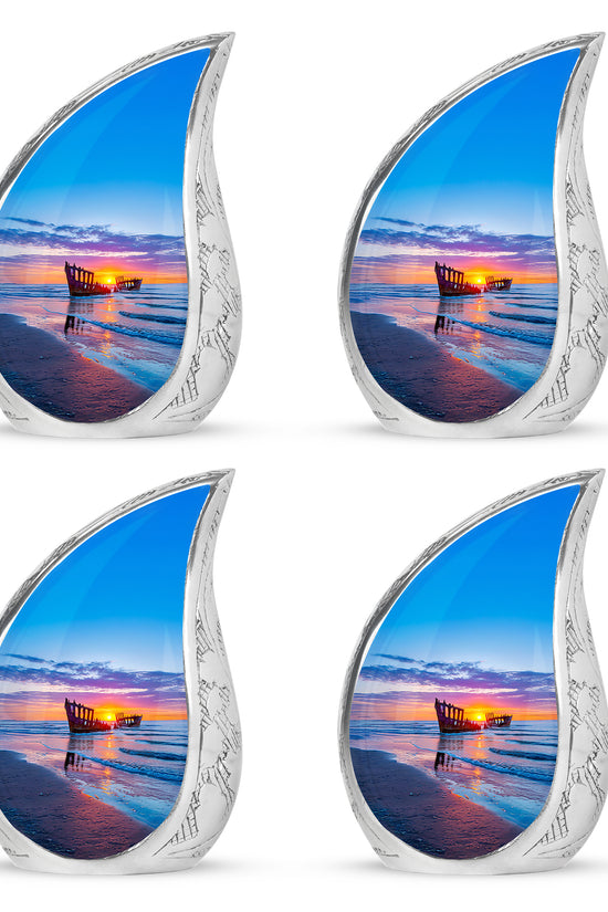 Royal Blue Beach Cremation Urn close-up of engraving and surface detail - graceful tear-shaped urn with beach motif - 10 inch aluminum urn for cremated remains