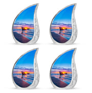 Royal Blue Beach Cremation Urn close-up of engraving and surface detail - graceful tear-shaped urn with beach motif - 10 inch aluminum urn for cremated remains