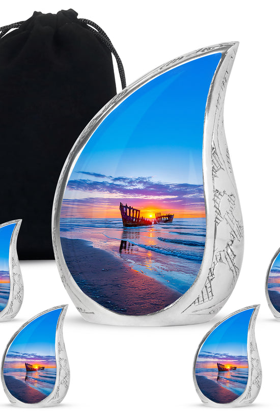 Twilight Blue Beach Cremation Urn side profile showing urn shape - graceful tear-shaped urn with beach motif - memorial set with one large and four small urns