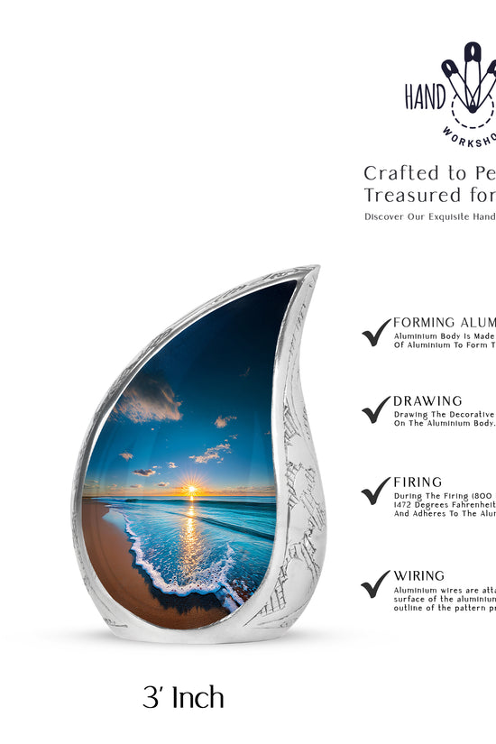 Sapphire Blue Beach Cremation Urn angled view of lid and engraved motif - graceful tear-shaped urn with beach motif - mini keepsake memorial for portion of cremation ashes