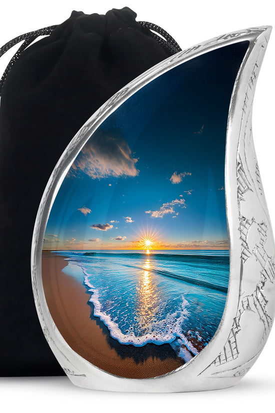 Navy Blue Beach Cremation Urn front view showing detailed design - flowing teardrop beach silhouette on curved aluminum - full-size 10 inch 200 cubic inch adult cremation urn