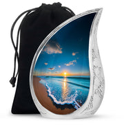 Navy Blue Beach Cremation Urn front view showing detailed design - flowing teardrop beach silhouette on curved aluminum - full-size 10 inch 200 cubic inch adult cremation urn
