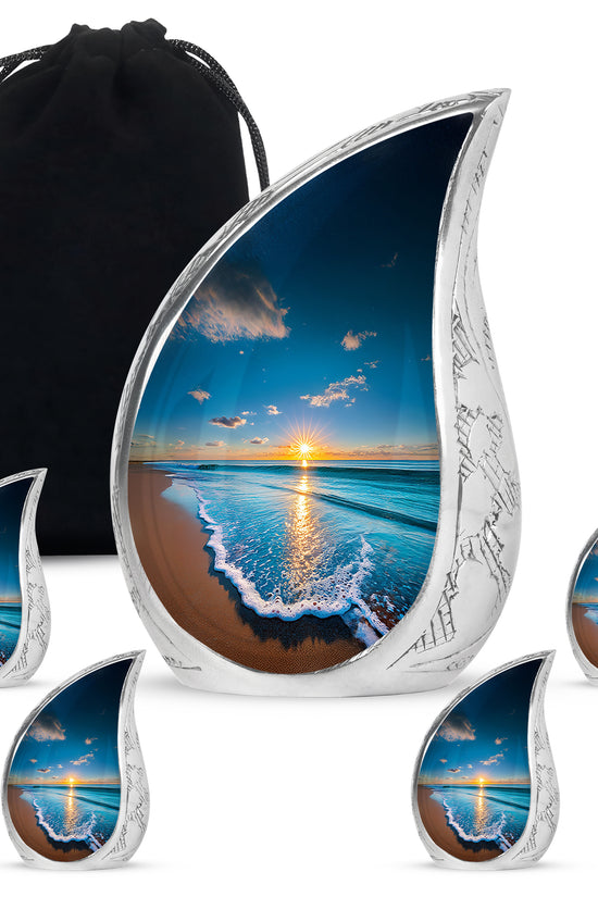 Misty Blue Beach Cremation Urn side profile showing urn shape - flowing teardrop beach silhouette on curved aluminum - memorial set with one large and four small urns