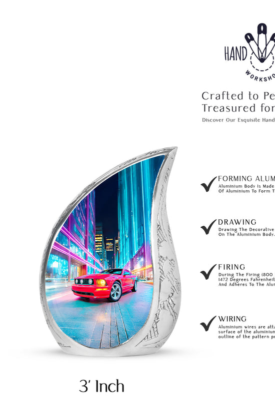 Pastel Blue Car Cremation Urn angled view of lid and engraved motif - flowing teardrop car silhouette on curved aluminum - mini keepsake memorial for portion of cremation ashes