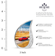 Powder Blue Car Cremation Urn angled view of lid and engraved motif - rounded teardrop car design with delicate detail - mini keepsake memorial for portion of cremation ashes