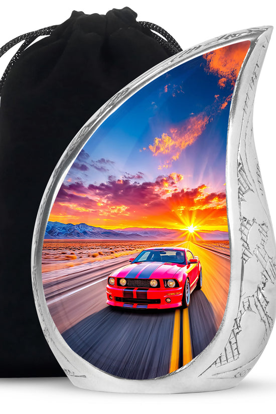 Coral Pink Car Cremation Urn front view showing detailed design - flowing teardrop car silhouette on curved aluminum - full-size 10 inch 200 cubic inch adult cremation urn