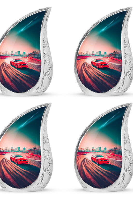 Cherry Red Car Cremation Urn close-up of engraving and surface detail - graceful tear-shaped urn with car motif - 10 inch aluminum urn for cremated remains