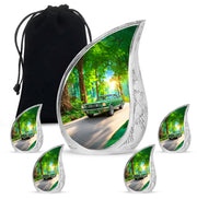 Jade Green Car Cremation Urn side profile showing urn shape - flowing teardrop car silhouette on curved aluminum - memorial set with one large and four small urns