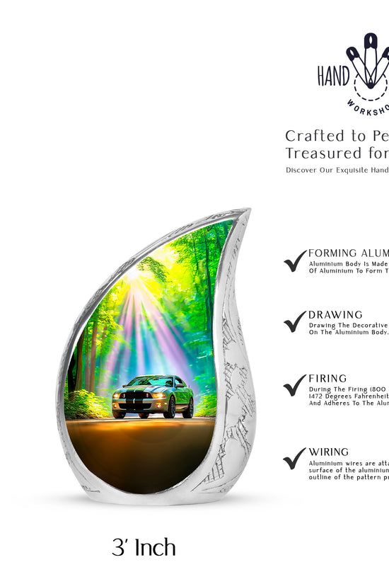 Deep Teal Car Cremation Urn angled view of lid and engraved motif - smooth teardrop contour featuring car art - mini keepsake memorial for portion of cremation ashes