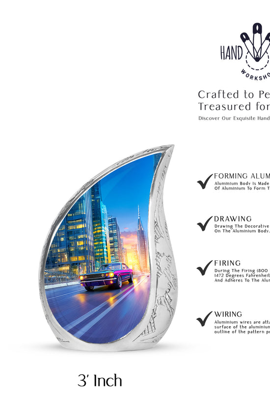 Icy Blue Car Cremation Urn angled view of lid and engraved motif - rounded teardrop car design with delicate detail - mini keepsake memorial for portion of cremation ashes