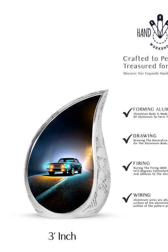 Rich Black Car Cremation Urn angled view of lid and engraved motif - rounded teardrop car design with delicate detail - mini keepsake memorial for portion of cremation ashes
