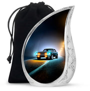 Rich Black Car Cremation Urn front view showing detailed design - flowing teardrop car silhouette on curved aluminum - full-size 10 inch 200 cubic inch adult cremation urn