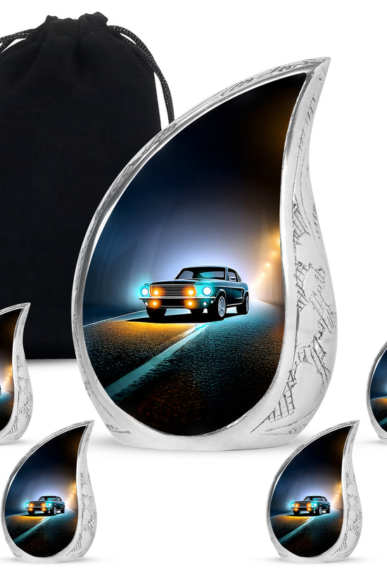 Ebony Car Cremation Urn side profile showing urn shape - rounded teardrop car design with delicate detail - memorial set with one large and four small urns